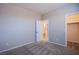 A simple bedroom leads to a bathroom and walk-in closet at 8026 Sunset Creek St, Las Vegas, NV 89113
