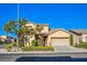 Inviting two-story home with a well-maintained lawn, tidy landscaping, and an attached two-car garage at 8026 Sunset Creek St, Las Vegas, NV 89113