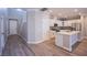 Modern kitchen with white cabinets, stainless steel appliances, and a large center island at 8026 Sunset Creek St, Las Vegas, NV 89113