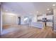 Open living and kitchen area featuring an island with seating and stainless steel appliances at 8026 Sunset Creek St, Las Vegas, NV 89113
