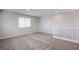 Large carpeted loft area with multiple windows offering plenty of natural light at 8026 Sunset Creek St, Las Vegas, NV 89113