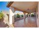 Spacious covered patio featuring tile flooring with landscaped yard and a tranquil ambiance at 8026 Sunset Creek St, Las Vegas, NV 89113