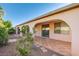 The backyard features a covered patio area with tile flooring and well-maintained landscaping at 8026 Sunset Creek St, Las Vegas, NV 89113