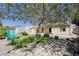 Lush backyard featuring mature tree providing ample shade, stone pavers and storage shed at 812 Bitterroot St, Henderson, NV 89002