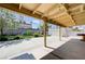 Spacious backyard with covered patio, lush landscaping, and storage shed at 812 Bitterroot St, Henderson, NV 89002