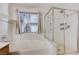 Modern bathroom with a bathtub and a separate glass-enclosed shower, ensuring a comfortable and relaxing experience at 812 Bitterroot St, Henderson, NV 89002