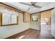 Charming bonus room with wood-look floors, bright windows, and a ceiling fan, offering comfort and style at 812 Bitterroot St, Henderson, NV 89002