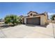 Beautiful single-story home featuring a spacious driveway, desert landscaping, and a two-car garage at 812 Bitterroot St, Henderson, NV 89002