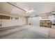 Well-lit two-car garage featuring ample storage and workshop space, perfect for organization and projects at 812 Bitterroot St, Henderson, NV 89002