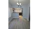 Inviting dining area flowing into kitchen with lots of natural light and sleek flooring at 8455 W Sahara Ave # 258, Las Vegas, NV 89117