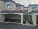 Condo building with covered parking, second-story units, and well-maintained landscaping at 8455 W Sahara Ave # 258, Las Vegas, NV 89117