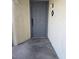 Exterior shot of a gray front door with modern hardware and the unit number displayed at 8455 W Sahara Ave # 258, Las Vegas, NV 89117