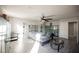 Bright bedroom featuring a ceiling fan and wood-look floors, providing a serene and inviting space for relaxation and rest at 8543 Alpine Vineyards Ct, Las Vegas, NV 89139