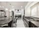 A kitchen featuring stainless steel appliances, custom cabinets, granite countertops, and a center island at 8543 Alpine Vineyards Ct, Las Vegas, NV 89139