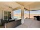 Charming back patio with outdoor seating, a built-in grill, and a view of the pool at 8934 Windgate Ranch St, Las Vegas, NV 89166