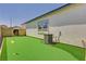 Backyard with a putting green, perfect for outdoor recreation and entertainment at 8934 Windgate Ranch St, Las Vegas, NV 89166