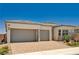 Attractive single-story home with a two-car garage and well-maintained desert landscaping at 8934 Windgate Ranch St, Las Vegas, NV 89166