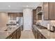 Bright kitchen with granite countertops, stainless steel appliances, and modern cabinetry with ample counter space at 8934 Windgate Ranch St, Las Vegas, NV 89166
