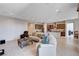 Open-concept living area with tile floors, recessed lighting, and access to the kitchen at 8934 Windgate Ranch St, Las Vegas, NV 89166