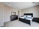 Well-lit main bedroom with a king bed, dresser, and side tables with tile flooring at 8934 Windgate Ranch St, Las Vegas, NV 89166