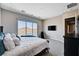 Bright bedroom with backyard views through sliding glass doors and a comfortable king-sized bed at 8934 Windgate Ranch St, Las Vegas, NV 89166