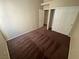 Bedroom featuring plush carpet, closet and entry doors, and neutral colored walls at 8959 Coral Shale St, Las Vegas, NV 89123