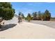 Backyard featuring shed with basketball hoop and shade trees at 901 E Jaybird St, Pahrump, NV 89048