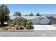 Charming single-story home with a well-manicured front yard and a two-car garage at 901 E Jaybird St, Pahrump, NV 89048