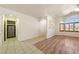 Spacious living area with wood floors and tiled entryway, leading to other rooms at 901 E Jaybird St, Pahrump, NV 89048