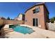 Backyard featuring a private pool and covered patio, perfect for outdoor enjoyment and relaxation at 9530 Windsor Forest Ct, Las Vegas, NV 89123
