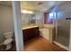 Bathroom with a large mirror, double sink vanity, soaking tub and glass enclosed shower at 9530 Windsor Forest Ct, Las Vegas, NV 89123