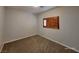Cozy bedroom with neutral carpeting and a window with wooden shutters at 9530 Windsor Forest Ct, Las Vegas, NV 89123