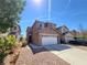 Charming two-story home with a two-car garage and a well-maintained front yard at 9530 Windsor Forest Ct, Las Vegas, NV 89123