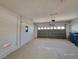 Spacious two-car garage with concrete floor and an automatic door providing convenient access and ample parking at 9530 Windsor Forest Ct, Las Vegas, NV 89123