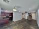 Open floor plan with slate tile flooring connecting the kitchen and living area at 9530 Windsor Forest Ct, Las Vegas, NV 89123