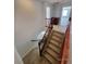 Carpeted staircase with decorative railing leading to the upper level of the home at 9530 Windsor Forest Ct, Las Vegas, NV 89123