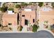 Aerial view of residential homes showcasing their well-maintained tile roofs, landscaping, and neighborhood layout at 9704 Brawley Dr, Las Vegas, NV 89134