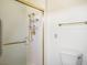 Bathroom featuring a glass-enclosed shower with gold fixtures and a modern toilet at 9704 Brawley Dr, Las Vegas, NV 89134