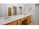 Well-lit bathroom with double sinks, vanity space, and a linen closet for ample storage at 9704 Brawley Dr, Las Vegas, NV 89134