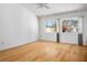 Bedroom featuring hardwood floors, neutral paint, and large windows providing ample natural light at 9704 Brawley Dr, Las Vegas, NV 89134