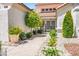 Inviting front yard featuring well-maintained landscaping and a secure gated entrance at 9704 Brawley Dr, Las Vegas, NV 89134