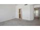 Spacious living room with neutral carpeting and an open layout, ready for personalized decor at 9704 Brawley Dr, Las Vegas, NV 89134