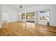 Bright living room features gleaming hardwood floors, a ceiling fan, and sliding doors to the backyard at 9704 Brawley Dr, Las Vegas, NV 89134