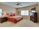 Neutral bedroom offers a ceiling fan, window, and classic furnishings at 10243 Songsparrow Ct, Las Vegas, NV 89135