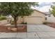 Charming single-story home with a well-maintained lawn and a two-car garage at 10243 Songsparrow Ct, Las Vegas, NV 89135