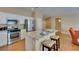 Bright kitchen features an island with granite countertop and stainless steel appliances at 10243 Songsparrow Ct, Las Vegas, NV 89135