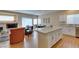 Modern island kitchen with granite counters and an open flow to the living space at 10243 Songsparrow Ct, Las Vegas, NV 89135