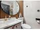 This half-bath features a modern countertop and a design-forward mirror and decorative elements at 10381 Borah Park Cir, Las Vegas, NV 89178