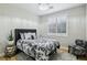 Serene bedroom with neutral tones, wood floors, and stylish decor accents at 10381 Borah Park Cir, Las Vegas, NV 89178