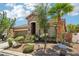 Charming single-story home featuring a stone facade, two-car garage, and drought-tolerant landscaping at 10381 Borah Park Cir, Las Vegas, NV 89178